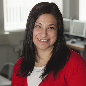 woman with long hair smiling