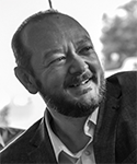 black and white profile of man with a beard