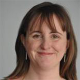 head and shoulder shot of woman smiling