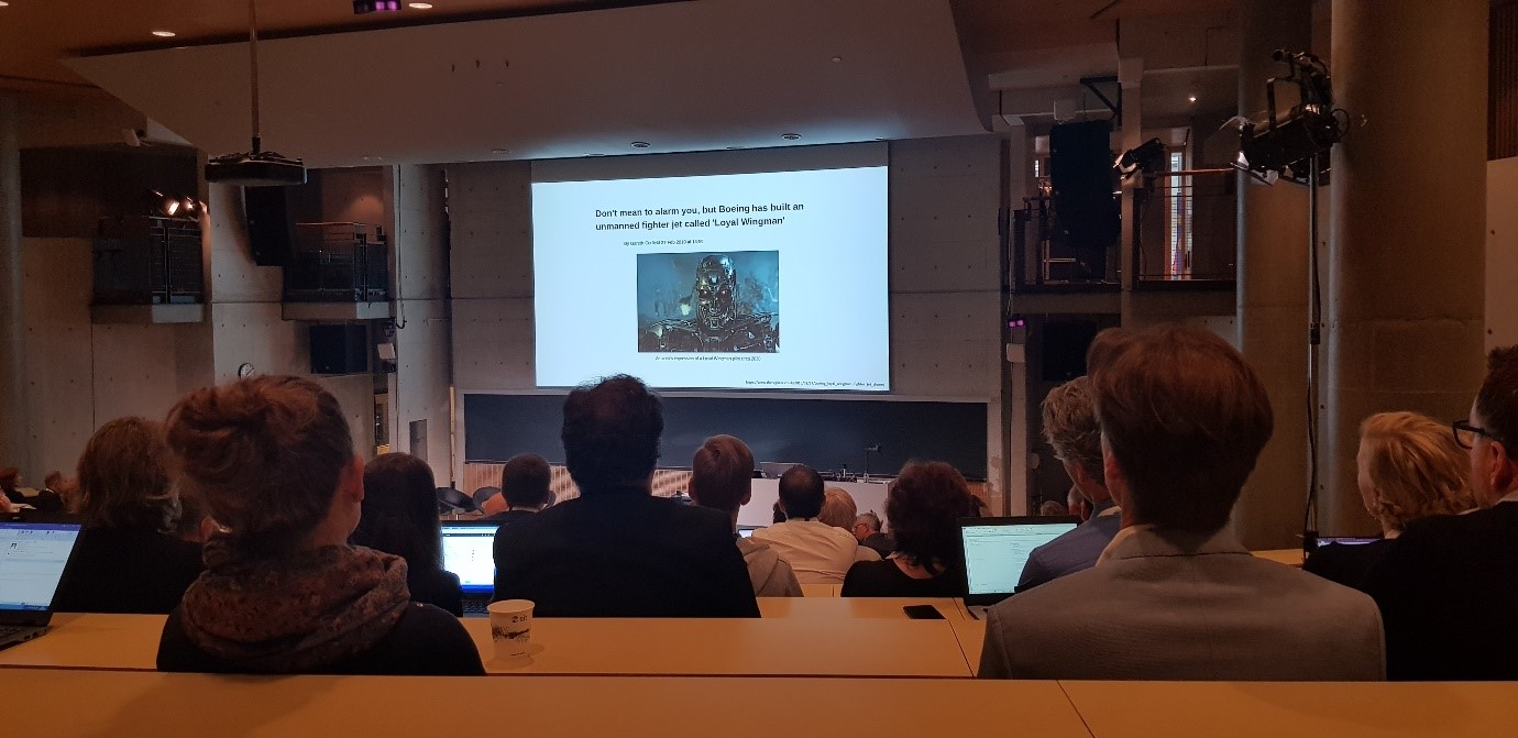 Photograph of an audience in a lecture theatre watching a EUNIS19 presentation